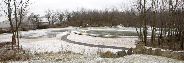 A three-cell forebay system, left, filtered water before it entered the 0.7 acre main pond, right, at McConnell Springs ?on Monday?. Kentucky.com